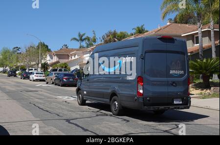 Amazon Prime delivery van out on deliveries in suburban neighborhood. Stock Photo