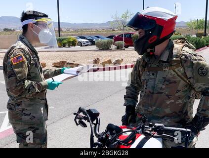 Pfc. David Hernandez, a medic with 1-221 Cavalry, screens military personnel before entering into government facilities, Friday, Apr. 10, 2020 in Las Vegas, Nevada. Stock Photo