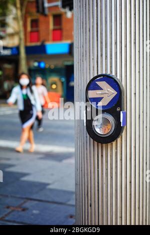 pedestrian crossing Covid-19 actions, walk light call buttons covered over to prevent the spreading of Corona virus in the Sydney CBD Stock Photo