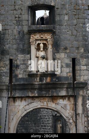 Statue of St. Blaise, Dubrovnik patron saint, on the wall above Pile gate Stock Photo