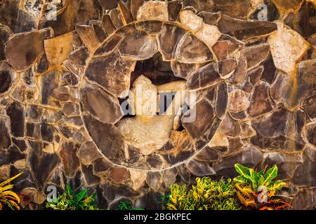 Statue of a Balinese woman and tropical foliage, Bali, Indonesia Stock Photo