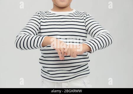 boy washes hands to wash Coronavirus from his hands sanitizer gel. Hand disinfection concept. Stock Photo