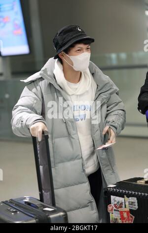 Chinese singer Charlie Zhou Shen arrives at a Shanghai airport after ...