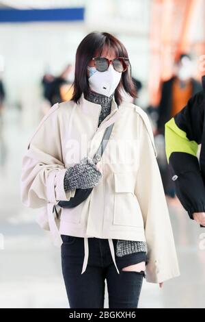 Chinese actress Zhang Yuxi arrives at a Beijing airport before ...