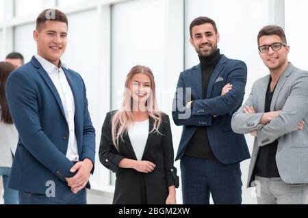 group of ambitious young employees standing in the office. Stock Photo