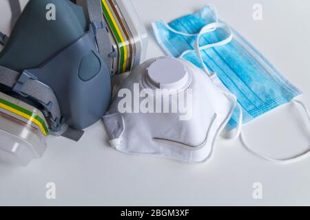 Three kind of protective face masks on gray background. Different types of protection. Stock Photo