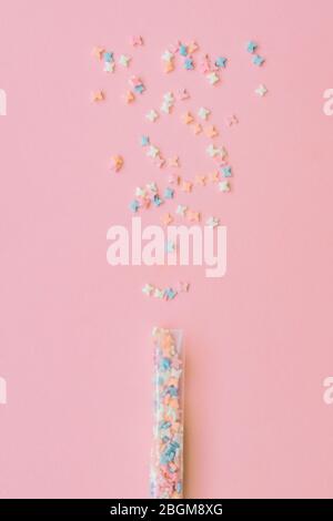 Sprinkles grainy. Sweet confetti. Pink background for holiday designs, party, birthday Stock Photo