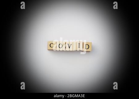 A close up of a the word covid on white with black background Stock Photo