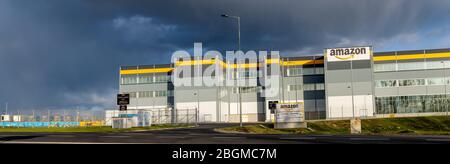 spectacular hail clouds rolling across the sky over the Amazon logistics center in Poland Stock Photo