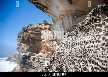 Dramatic rock formations eroded by wind and water along the Bondi to Coogee cliff walk in Sydney's Eastern suburbs, Australia. Stock Photo