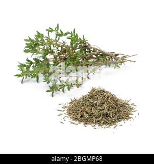 Heap of dried Thyme and fresh thyme twigs isolated on white background Stock Photo