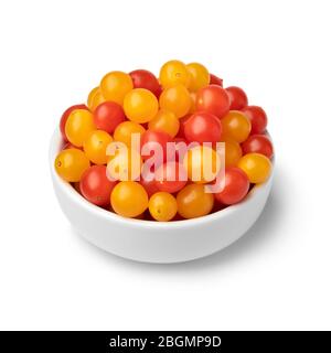 Bowl with red and yellow Tomberry tomatoes close up isolated on white background Stock Photo