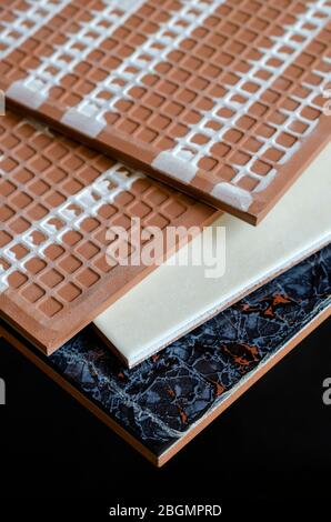 Ceramic tile close-up. A detailed shot of four ceramic tiles. Front and Back of ceramic tiles for walls and floors. Building materials. Selective focu Stock Photo