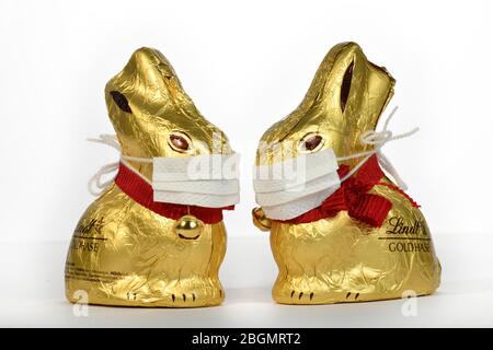 Symbol picture Easter during the Corona Crisis, two chocolate Easter bunnies with mouthguards, , Baden-Wuerttemberg, Germany Stock Photo
