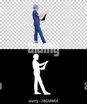Female neurosurgeon looking at MRI scan, Alpha Channel Stock Photo