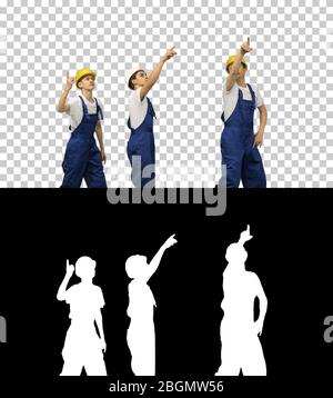 Three construction workers walking in a funny dacning way lookin Stock Photo