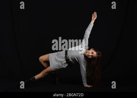 slim ballerina in the dark backgroung Stock Photo