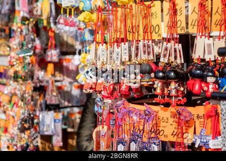 The famous wooden keychain in the form of kimono dolls which were sold in souvenir shop at Asakusa temple Tokyo, Japan February 7, 2020 Stock Photo