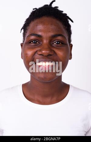 Face of happy young beautiful African woman smiling Stock Photo