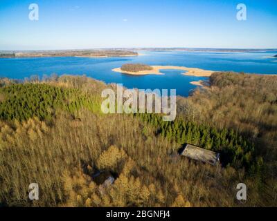 Aerial view of reinforced concrete bunkers belonged to Headquarters of German Land Forces from ww2 hidden in a forest on the Mamry Lake shore, Mamerki Stock Photo