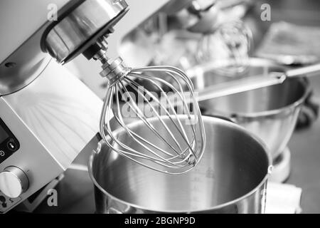 Professional steel electric mixer for kneading dough, cream in restaurant kitchen Stock Photo