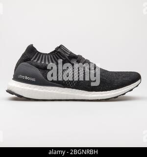 VIENNA, AUSTRIA - AUGUST 24, 2017: Adidas Ultra Boost black and white sneaker on white background. Stock Photo