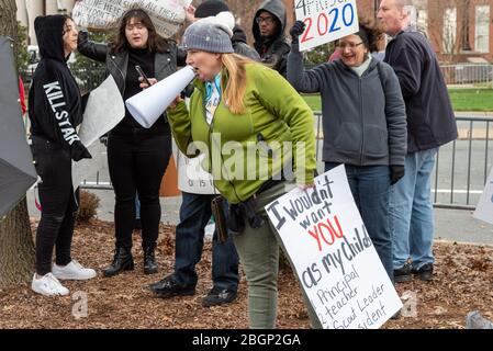 CHARLOTTE, NORTH CAROLINA/USA - February 7, 2020: Protester rallys anti-Trump demonstrators during the President's visit to Charlotte, North Carolina Stock Photo