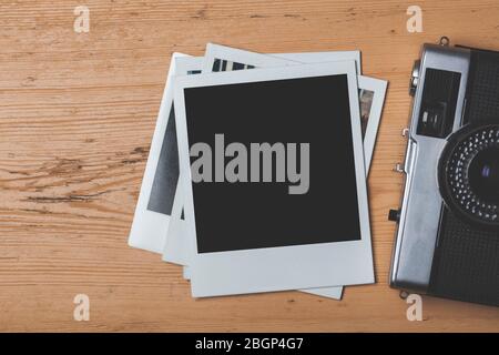 vintage retro camera with a blank instant photograph frame Stock Photo