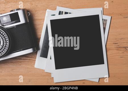 vintage retro camera with a blank instant photograph frame Stock Photo