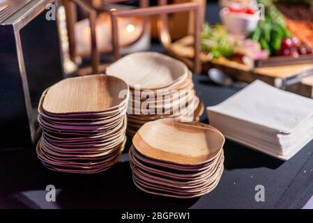 Eco environmentally friendly palm leaf plates made from natural sustainable leaves. Biodegradable alternative to paper, bamboo, plastic, or wood plate Stock Photo