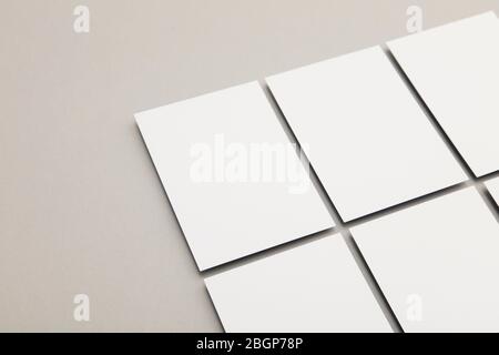 business card flyer poster mock up. White card on a grey background Stock Photo