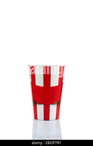 empty classic red and white paper striped bucket for popcorn isolated over the white background. Stock Photo