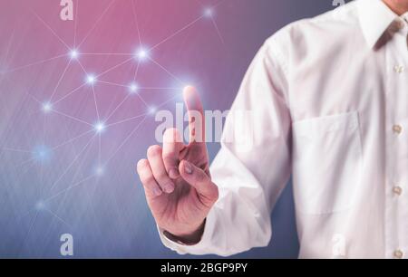 Businessman on blurred background touching flying network Stock Photo