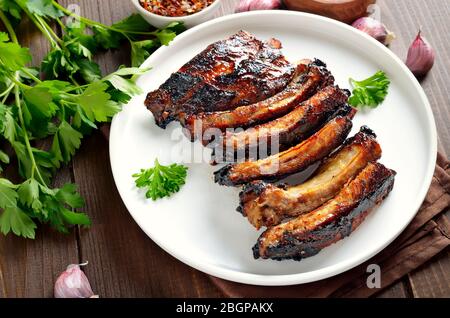 Fried pork ribs on plate, close up view Stock Photo