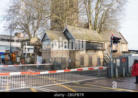 Disused High Street railway signal box beside operational level crossing Lincoln 2019 Stock Photo