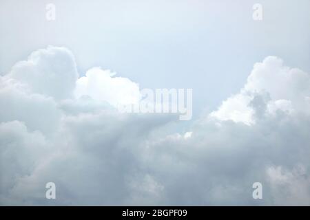 Sky landscape in pastel shades with gray gloomy clouds on the sky around by gray densest cumulus clouds Stock Photo