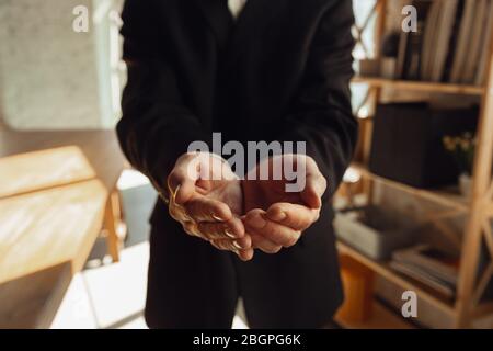 Folded hands. Close up of caucasian male hands, working in office. Concept of business, finance, job, online shopping or sales. Copyspace for advertising. Education, communication freelance. Stock Photo