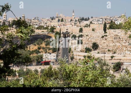 Israel, Jerusalem, Mount of Olives, The Lions' Gate or St. Stephen's Gate into the Muslim Quarter in the Old City of Jerusalem. At right is a Muslim cemetery outside the city walls. The Old City of Jerusalem and its Walls is a UNESCO World Heritage Site. Stock Photo