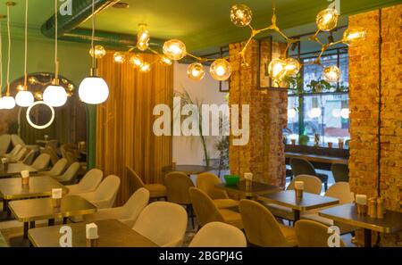 Coffee shop interior design With chairs and red bricks wall Stock Photo