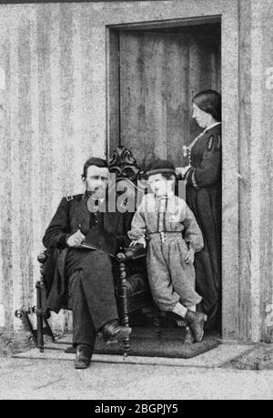 Lieutenant General Ulysses S. Grant (1822-1885) with his wife, Julia Boggs Grant (1848-1902), and son, Frederick Dent Grant (1850-1912), in 1864. During the American Civil War, Grant became the commander of all northern armies. Later be became President of the United States. Years later, when he found out he was dying, he wrote his autobiography, which sold extremely well, thereby supporting his family for decades.  To see my Civil War-related images, Search:  Prestor  vintage  Civil Stock Photo