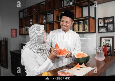 muslim couple preparing for breaking the fast on ramadan month Stock Photo