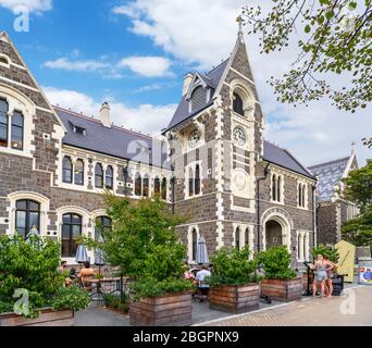 Cafe and Clock Tower Entrance to the Christchurch Arts Centre, Christchurch, New Zealand Stock Photo