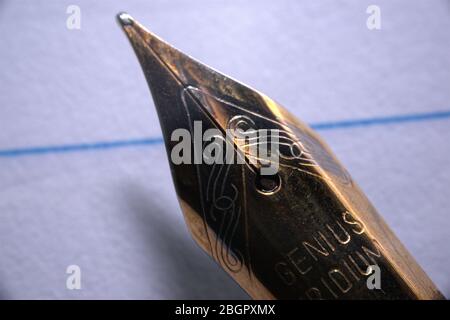 close up of fountain pen head on lined paper Stock Photo