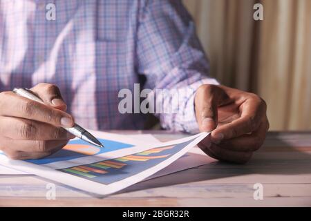 businessman analyzing working on office desk, top view  Stock Photo