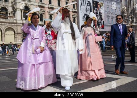Milan, Italy: 21 September 2019: Korean wedding couple, bride and groom on the square Piazza del Duomo, Cathedral Duomo di Milano, Cathedral Birth of Stock Photo