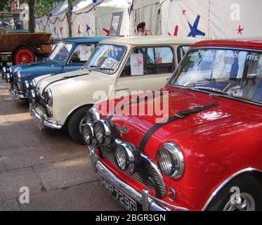 Car display of famous film cars in Leicester Square the three mini coopers from the film The Italian Job London England UK Stock Photo