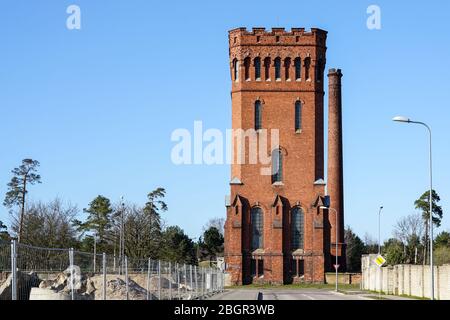 industrial heritage, an old square shaped water tower made of red bricks Stock Photo