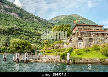 Shipping Pier of Isola Comacina at Lake Como seen from the lakeside, Lombardy, Italy Stock Photo