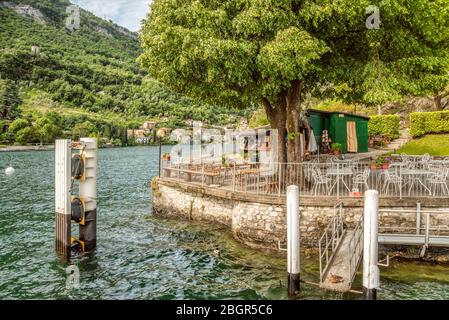 Shipping Pier of Isola Comacina at Lake Como seen from the lakeside, Lombardy, Italy Stock Photo