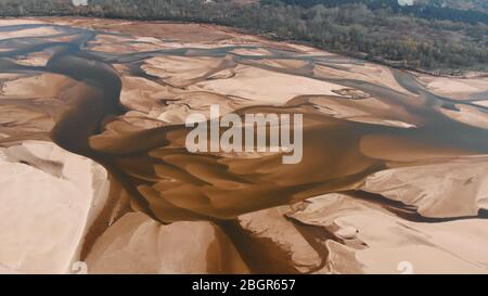 Dramatic aerial view of empty Vistula riverbed in Poland. Very dry summer. Drought natural disaster. Stock Photo